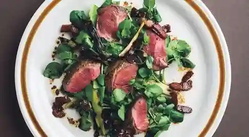 cooked pigeon breast salad